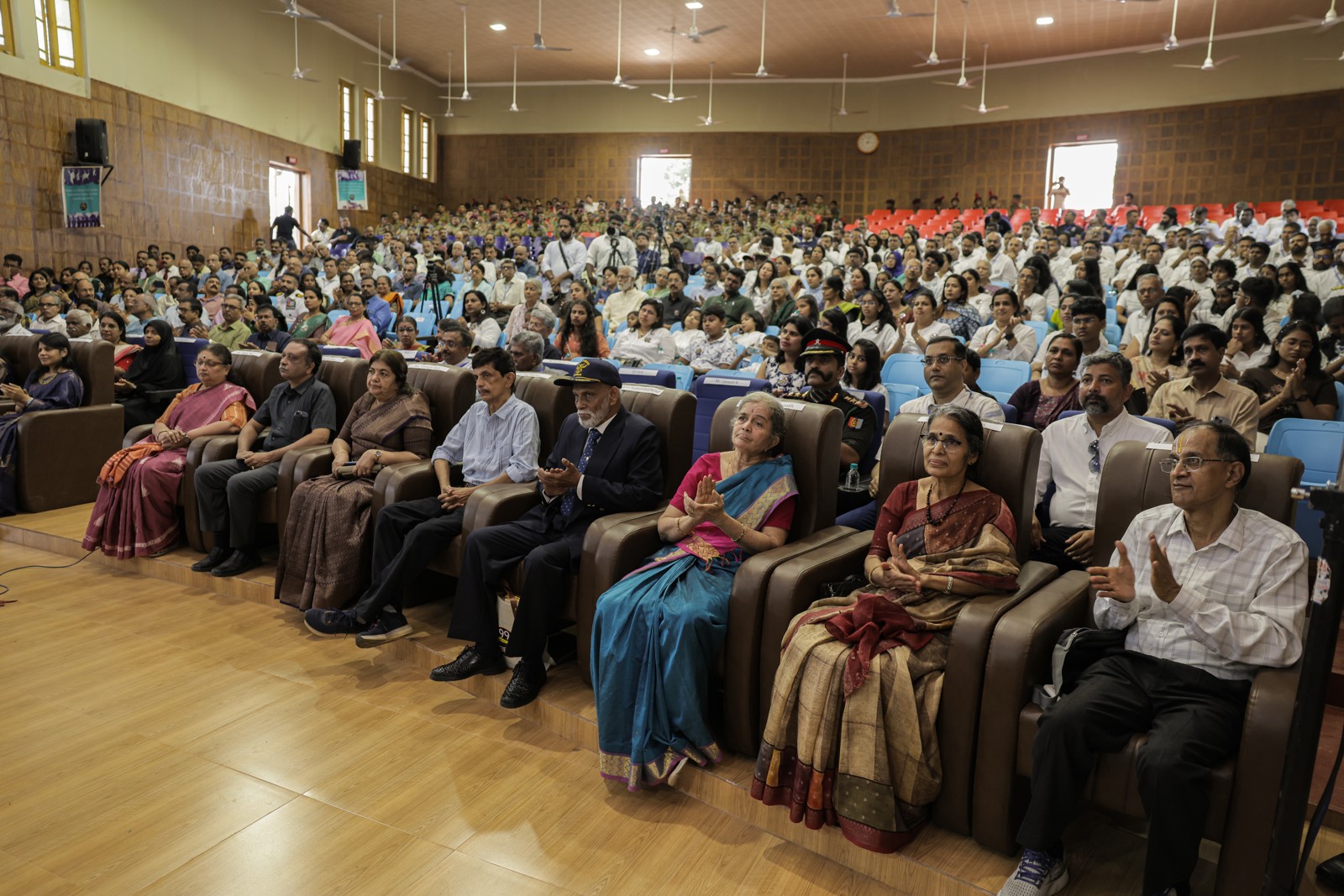Old Boys, teachers and families gathered in the school auditorium